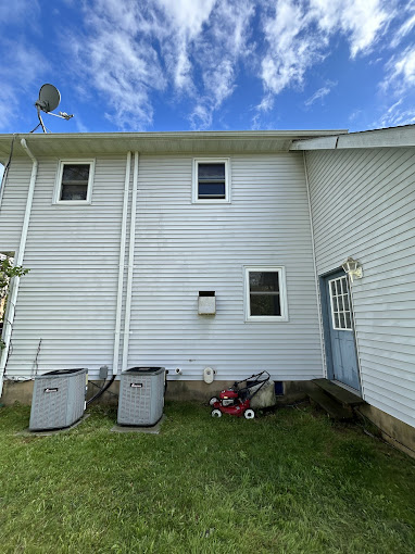 House exterior after professional pressure washing - restored and clean